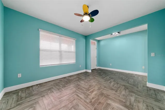 a view of an empty room with a window