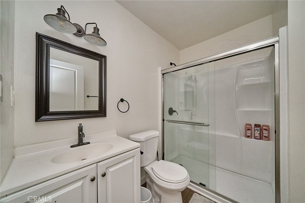 8734 Ramsgate Avenue Los Angeles, CA 90045 - Photo 15 of 19 a bathroom with a toilet sink and shower