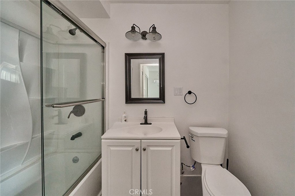 8734 Ramsgate Avenue Los Angeles, CA 90045 - Photo 17 of 19 a bathroom with a toilet sink and shower