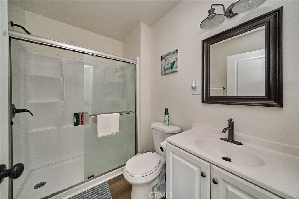 8734 Ramsgate Avenue Los Angeles, CA 90045 - Photo 19 of 19 a bathroom with a toilet a sink and mirror