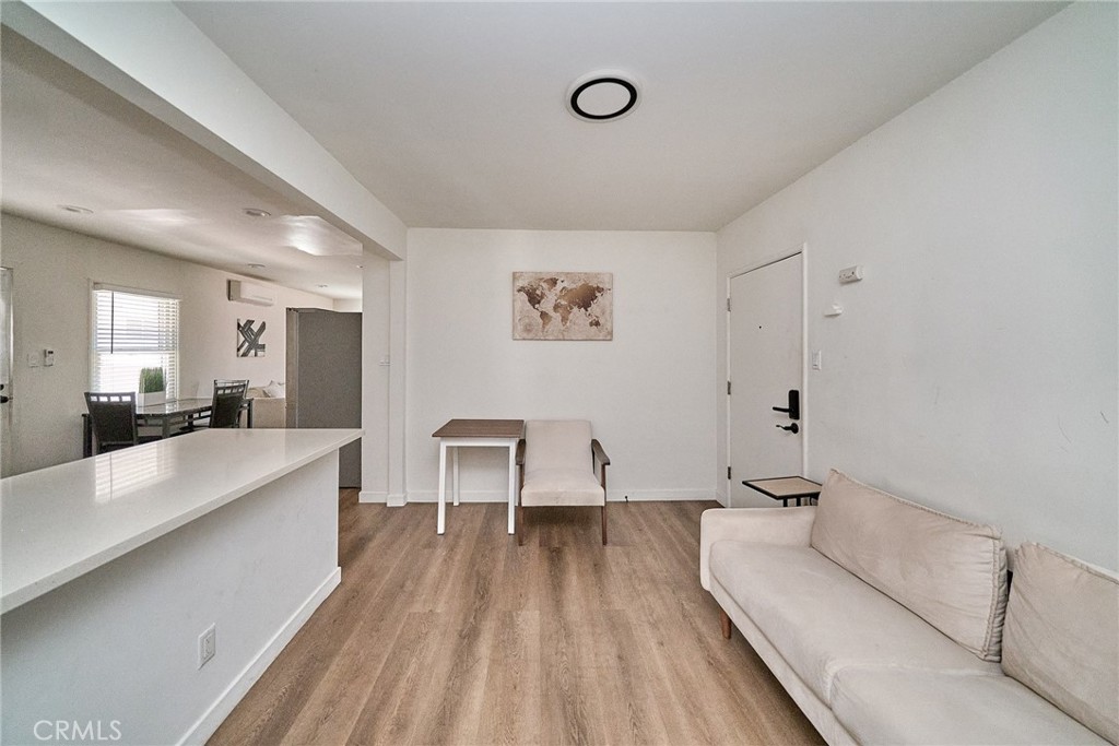 8734 Ramsgate Avenue Los Angeles, CA 90045 - Photo 10 of 19 a living room with a couch and a large window