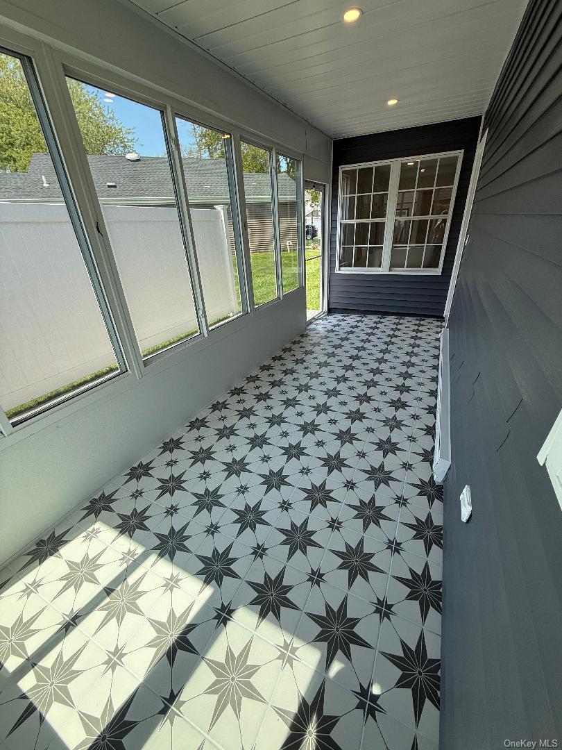 379 Larchmont Court Ridge, NY 11961 - Photo 8 of 17 a view of a porch