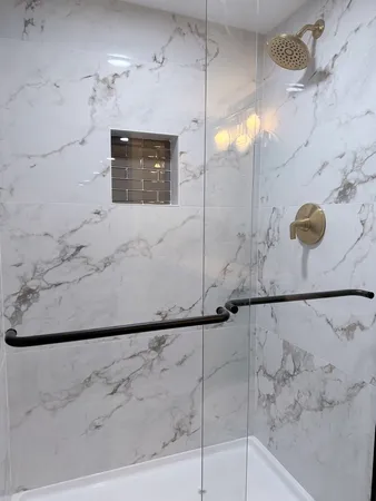 a bathroom with a bathtub and shower