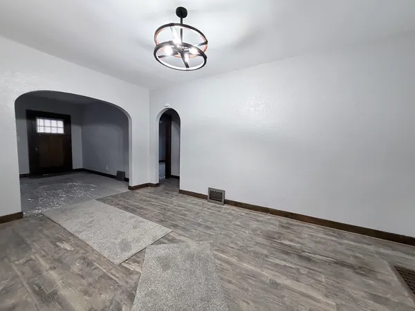 a view of an empty room with a window