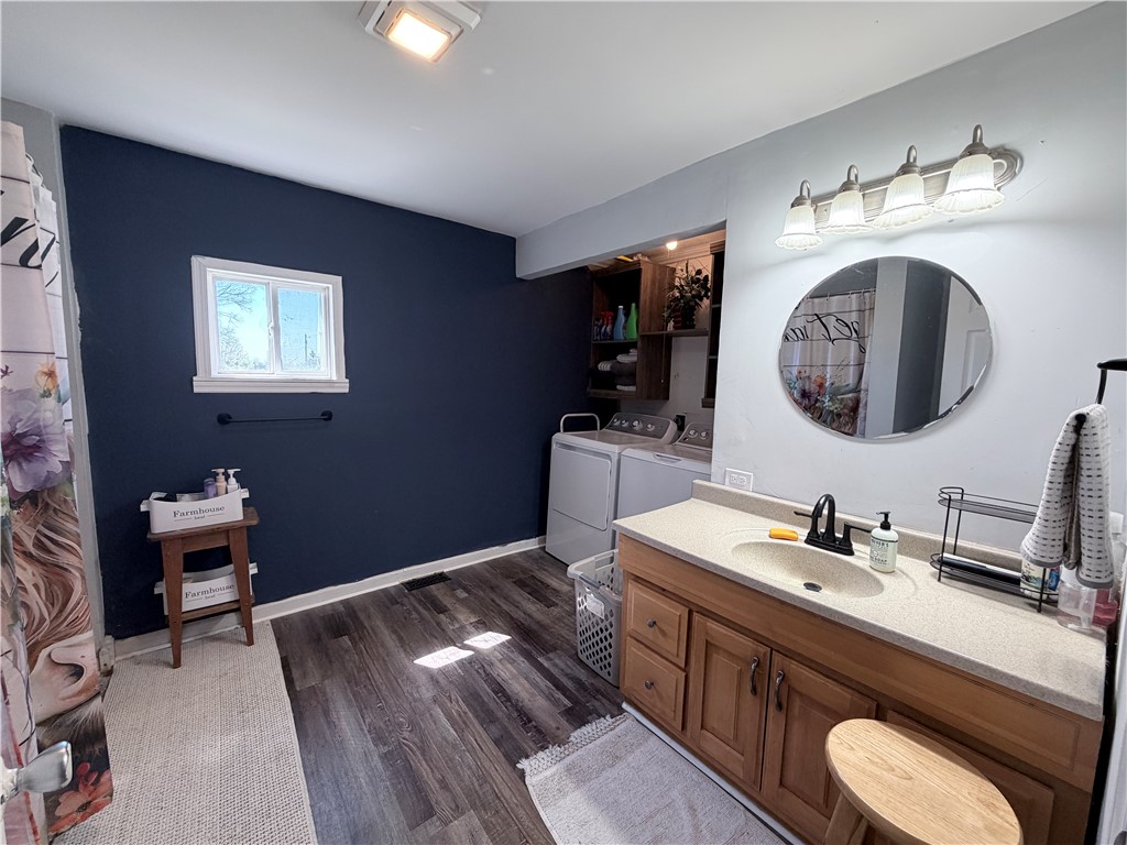 6800 Farmington Road Miamisburg, OH 45342 - Photo 16 of 32 This bright bathroom features a spacious vanity and convenient in-unit laundry.