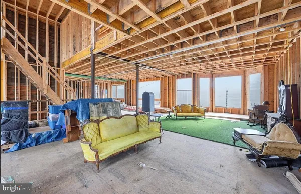 a backyard of a house with a table and chairs