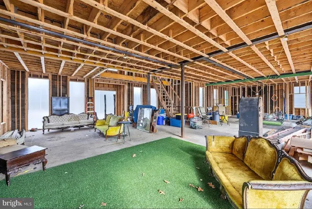 a view of a backyard with swimming pool