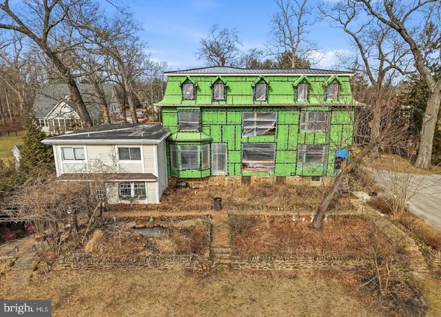 a view of a front of a house with a yard