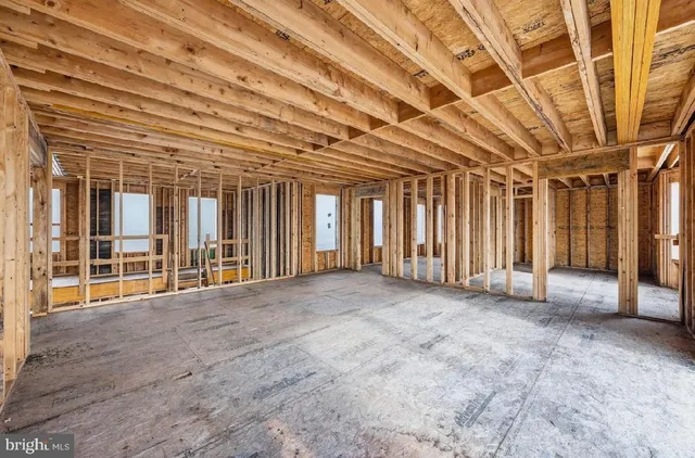 a view of an empty room with windows