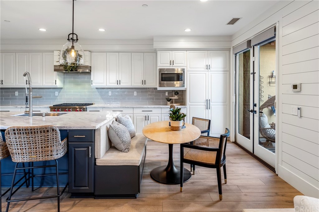 2 Emmy Lane Ladera Ranch, CA 92694 - Photo 14 of 25 a kitchen with stainless steel appliances granite countertop a stove top oven a refrigerator a sink and white cabinets