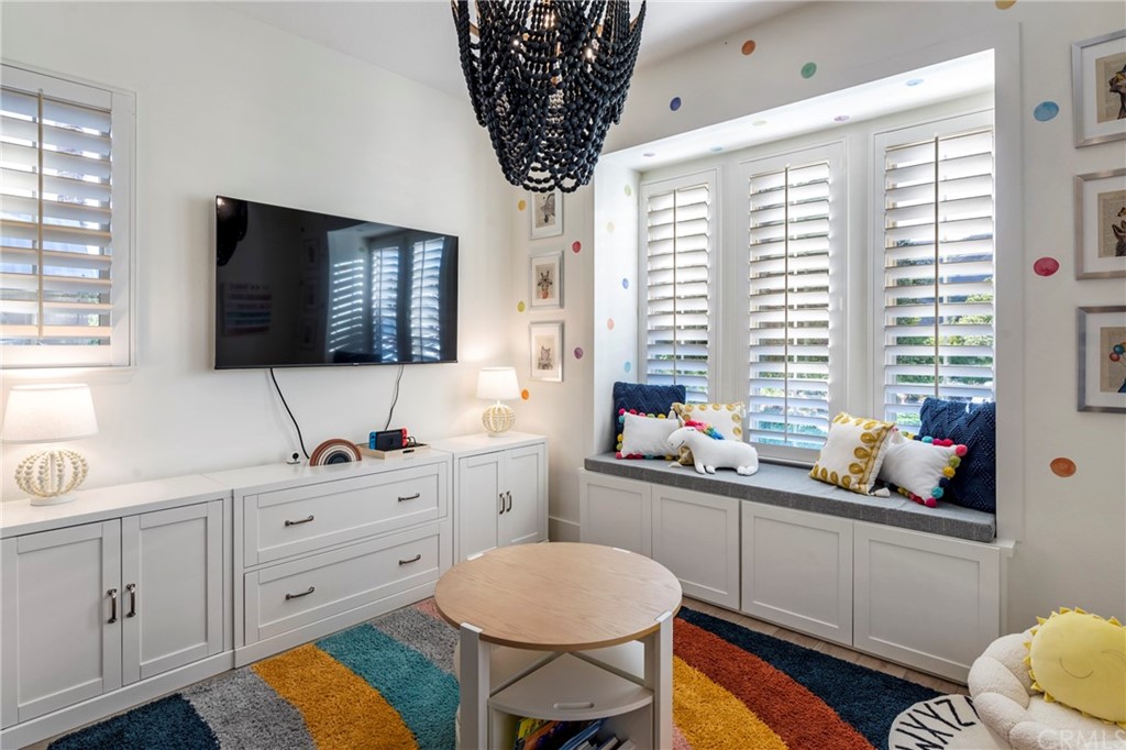 2 Emmy Lane Ladera Ranch, CA 92694 - Photo 17 of 25 a kitchen that has a sink a window and a dining table with chairs