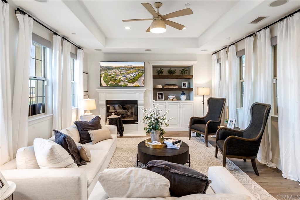 2 Emmy Lane Ladera Ranch, CA 92694 - Photo 9 of 25 a living room with furniture a fireplace and a large window