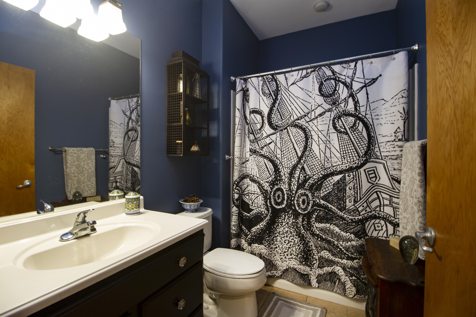3741 East Chestnut Street Kankakee, IL 60901 - Photo 11 of 44 a bathroom with a toilet sink and mirror