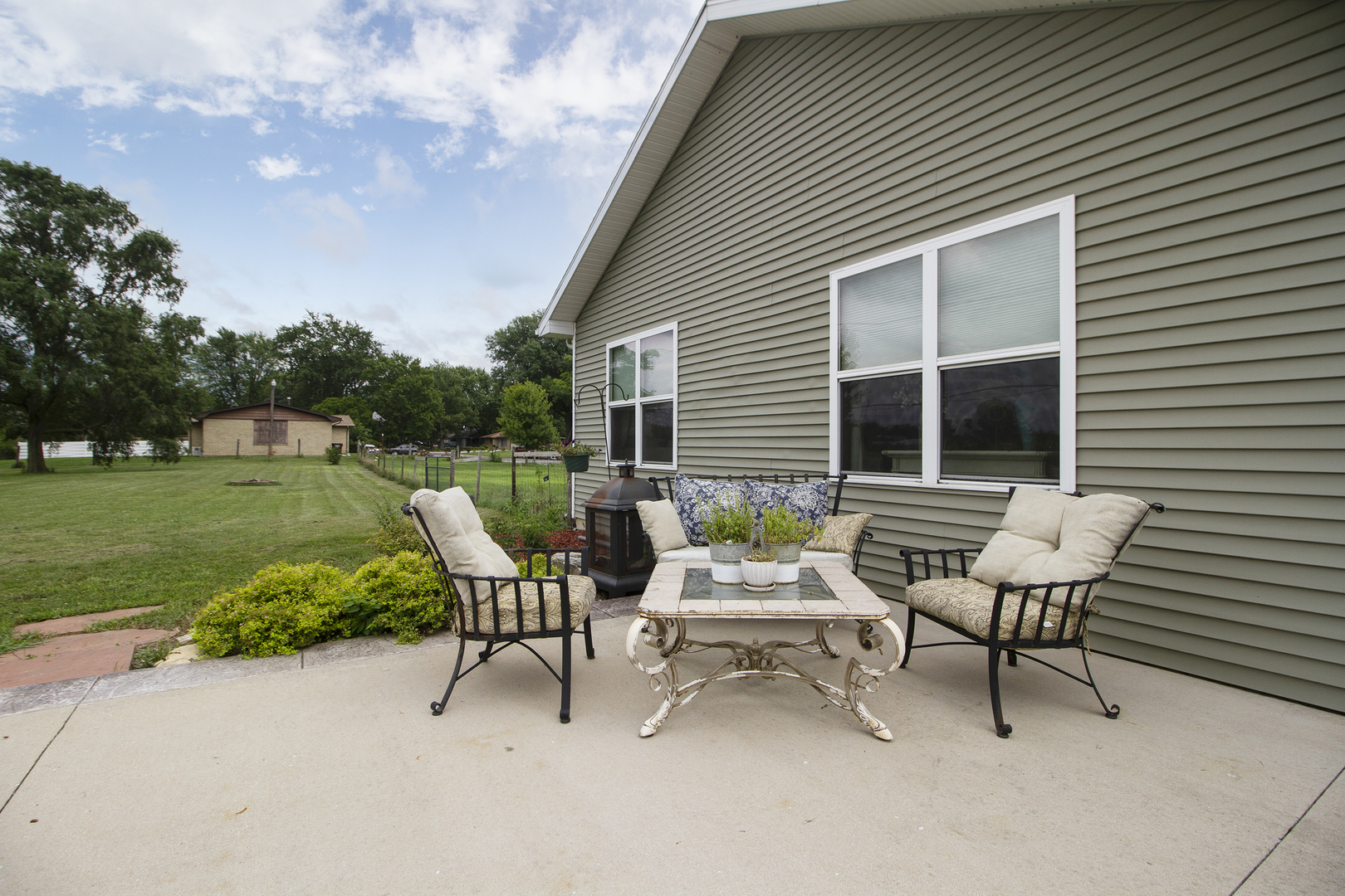 3741 East Chestnut Street Kankakee, IL 60901 - Photo 22 of 44 a view of a house with backyard porch and sitting area