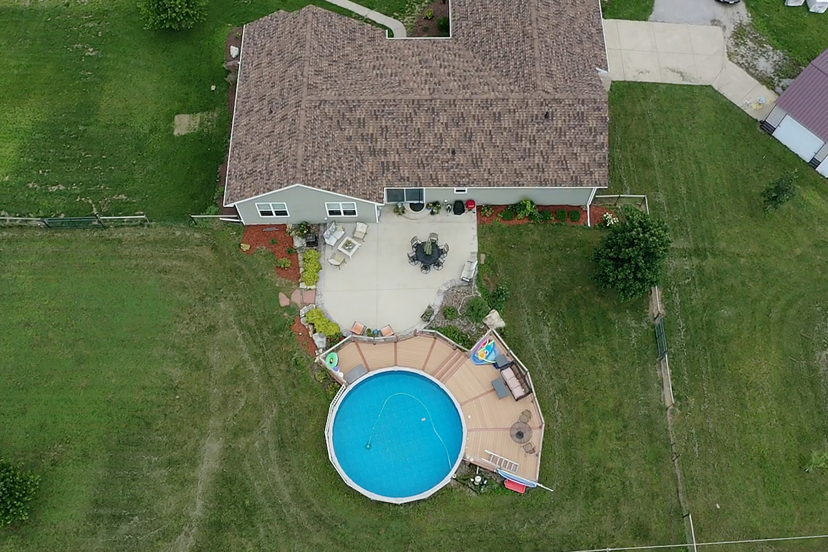 3741 East Chestnut Street Kankakee, IL 60901 - Photo 32 of 44 an aerial view of a house with pool yard and outdoor seating