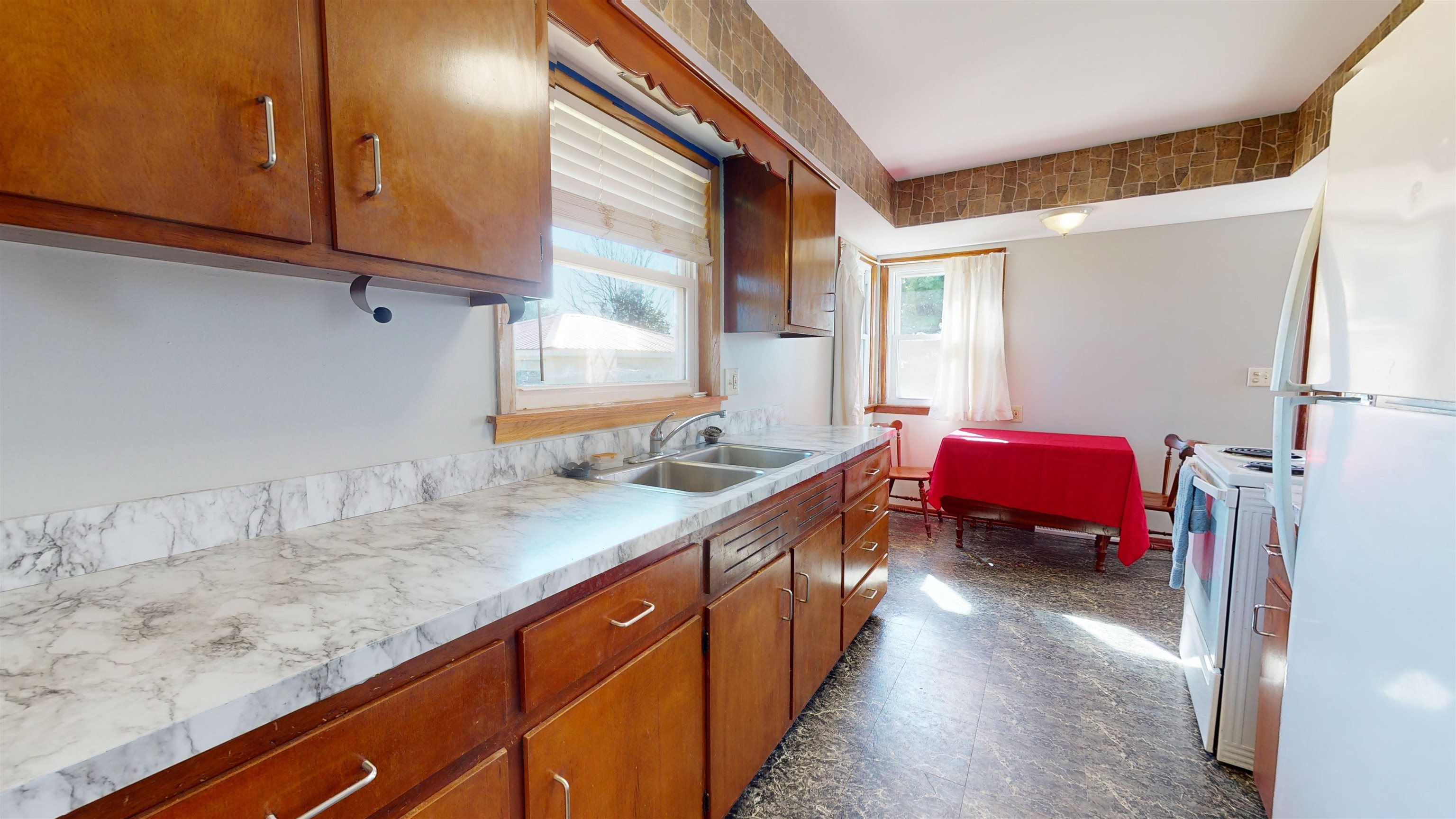 18915 East Quarry Road Monroe Center, IL 61052 - Photo 5 of 16 a kitchen with sink a refrigerator and cabinets