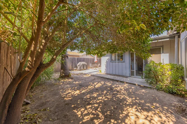 a view of a house with a tree