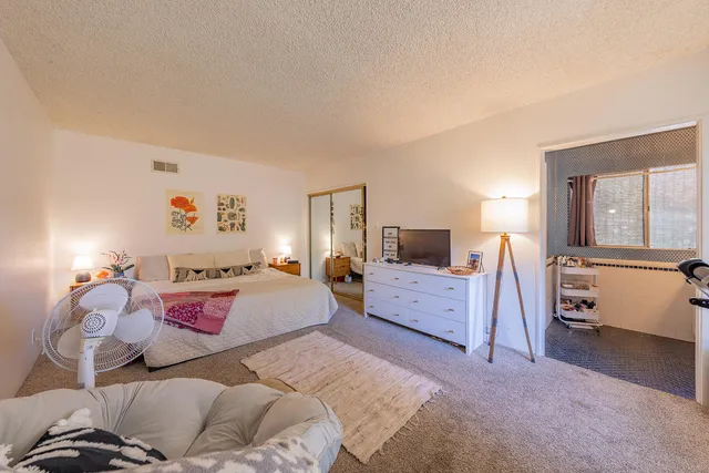 a bedroom with a bed and furniture