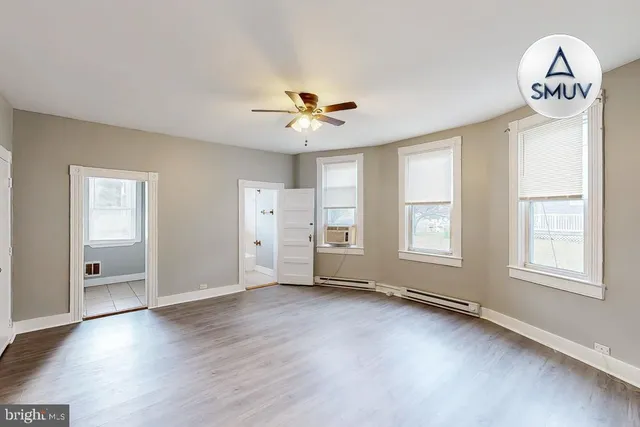 a view of an empty room with a window