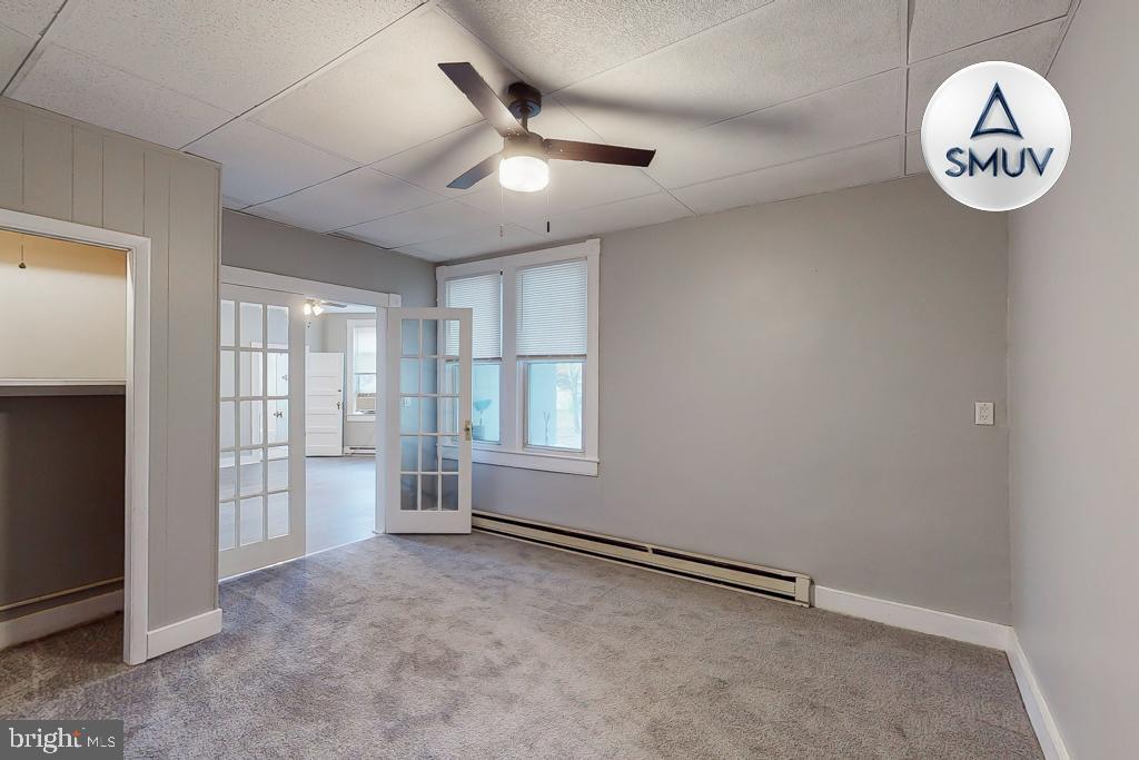 14 East Overlea Avenue, Unit 1 Baltimore, MD 21206 - Photo 6 of 15 an empty room with a window