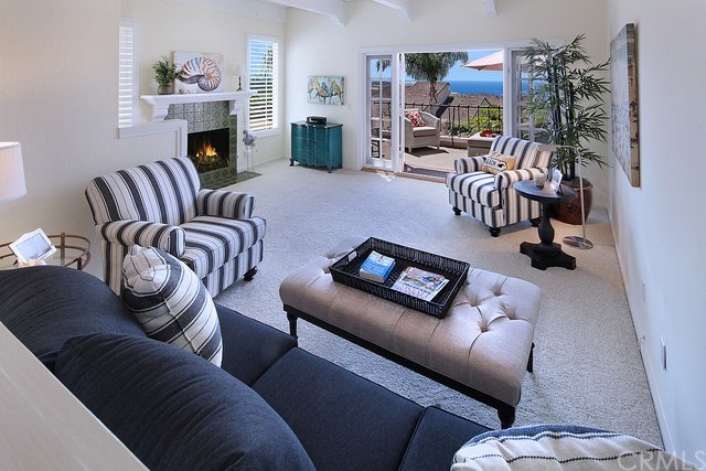 23281 Pompeii Drive, Unit 3 Dana Point, CA 92629 - Photo 3 of 19 Living Room with Fireplace opens to Deck