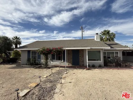 a kitchen with stainless steel appliances granite countertop a stove and a refrigerator
