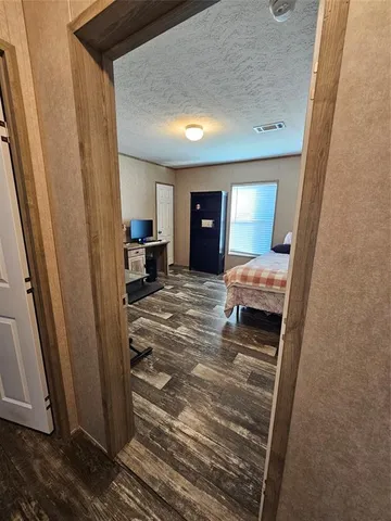 a room with a bed and a mirror