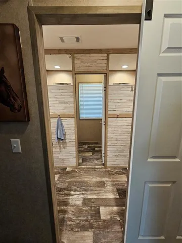 a bathroom with a sink a mirror and shower