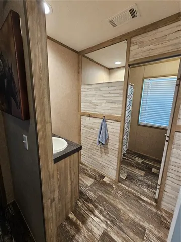 a view of a door and chair in a room