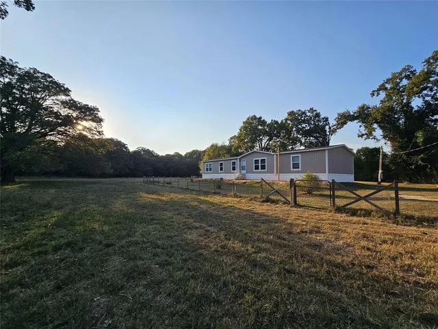 a house view with a garden space
