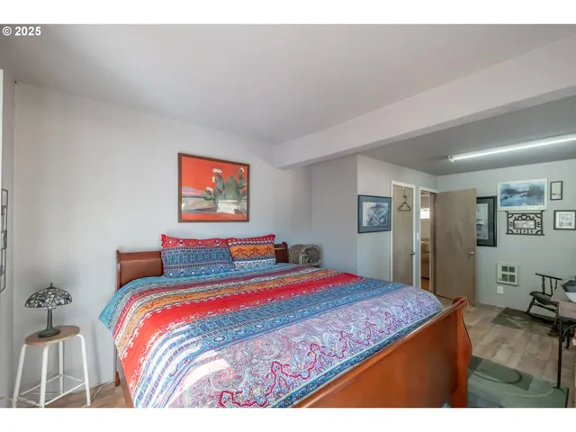 a bedroom with a bed and dresser