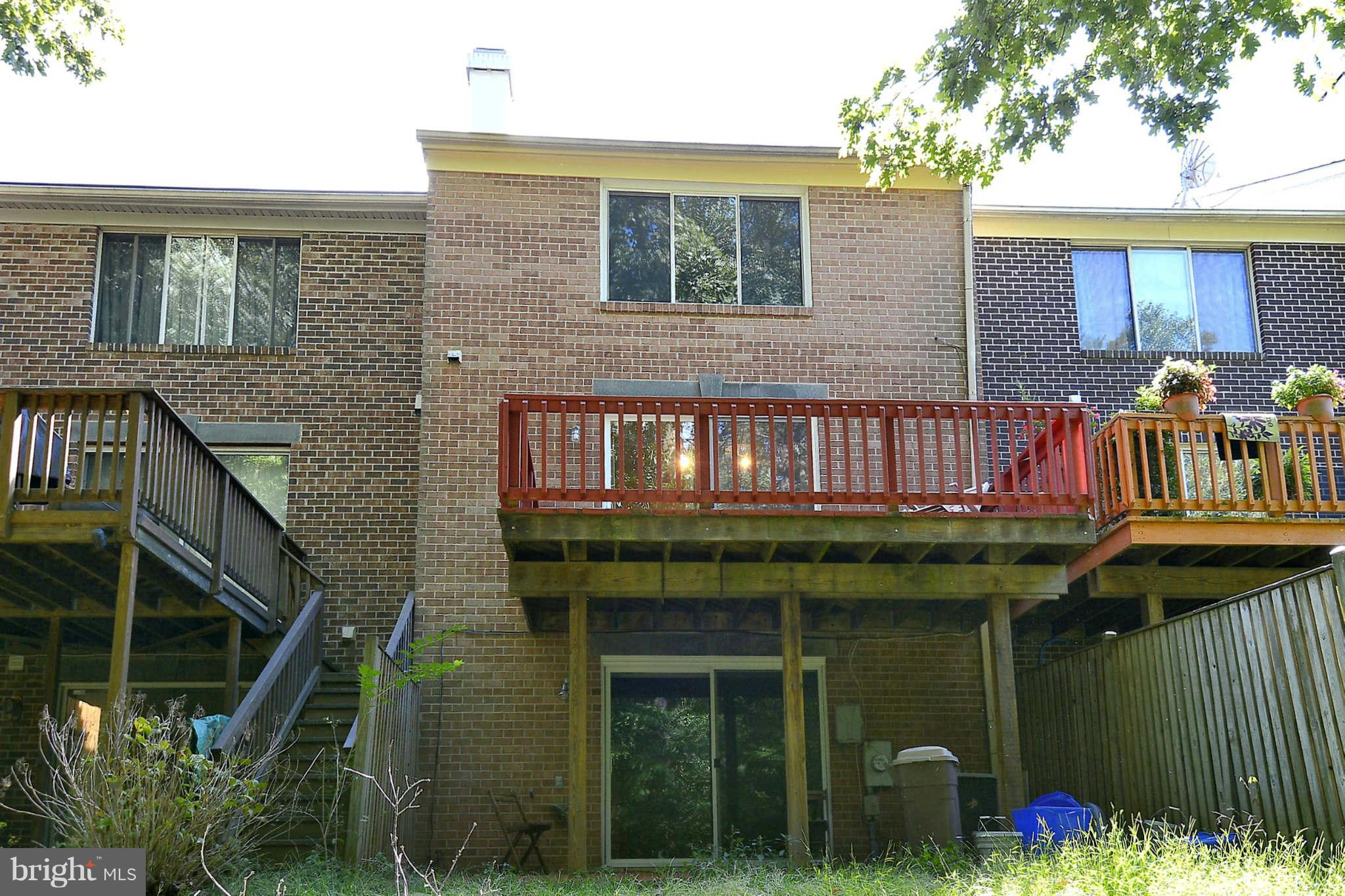 11457 Encore Drive Silver Spring, MD 20901 - Photo 2 of 27 a view of backyard with barbeque grill and outdoor seating