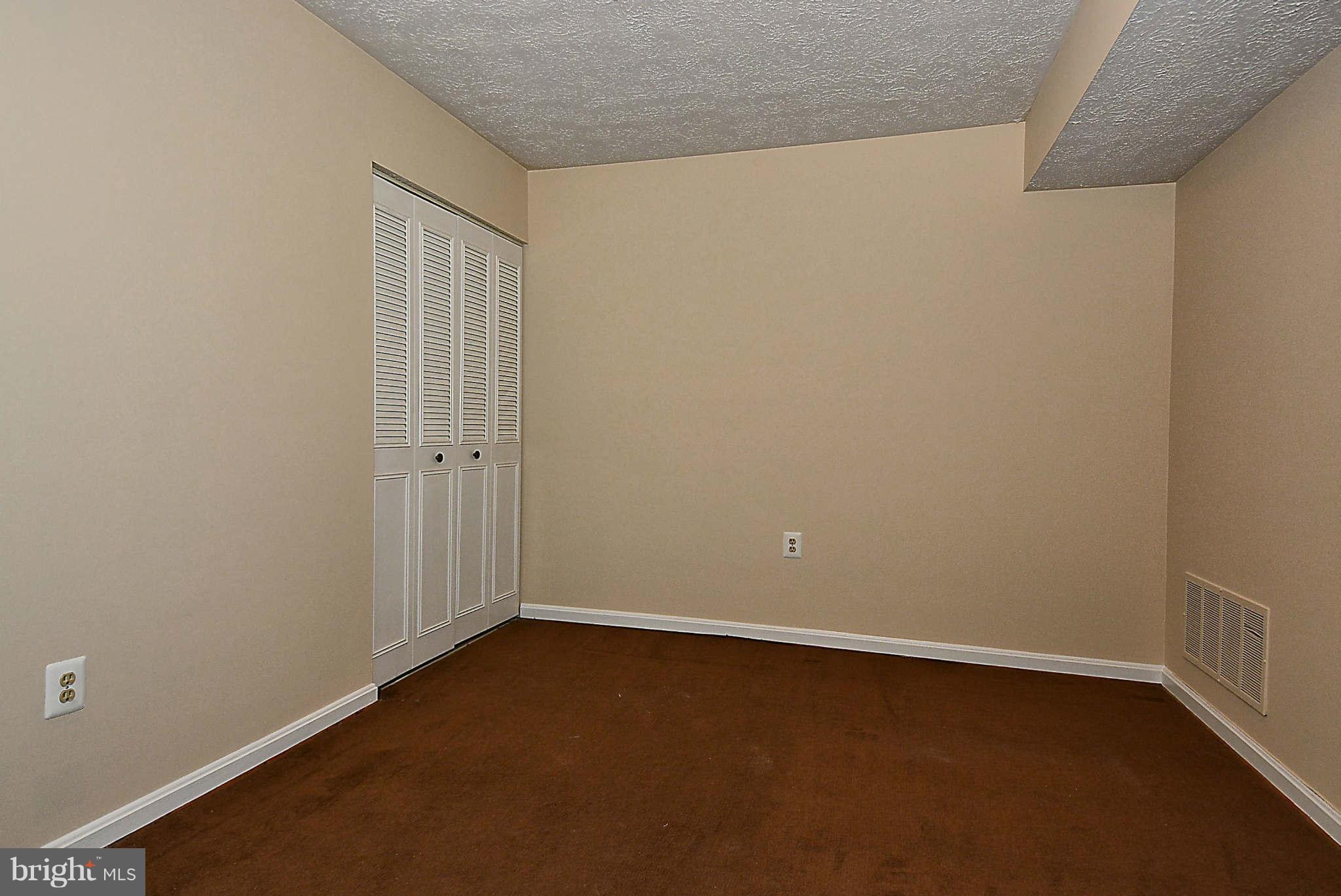 11457 Encore Drive Silver Spring, MD 20901 - Photo 19 of 27 an empty room with a door