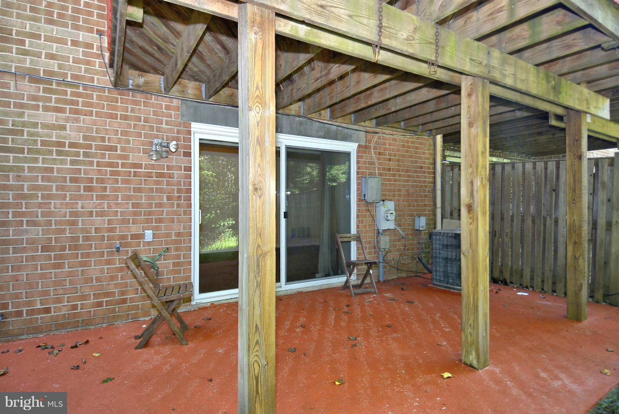 11457 Encore Drive Silver Spring, MD 20901 - Photo 24 of 27 a backyard of a house with barbeque oven table and chairs