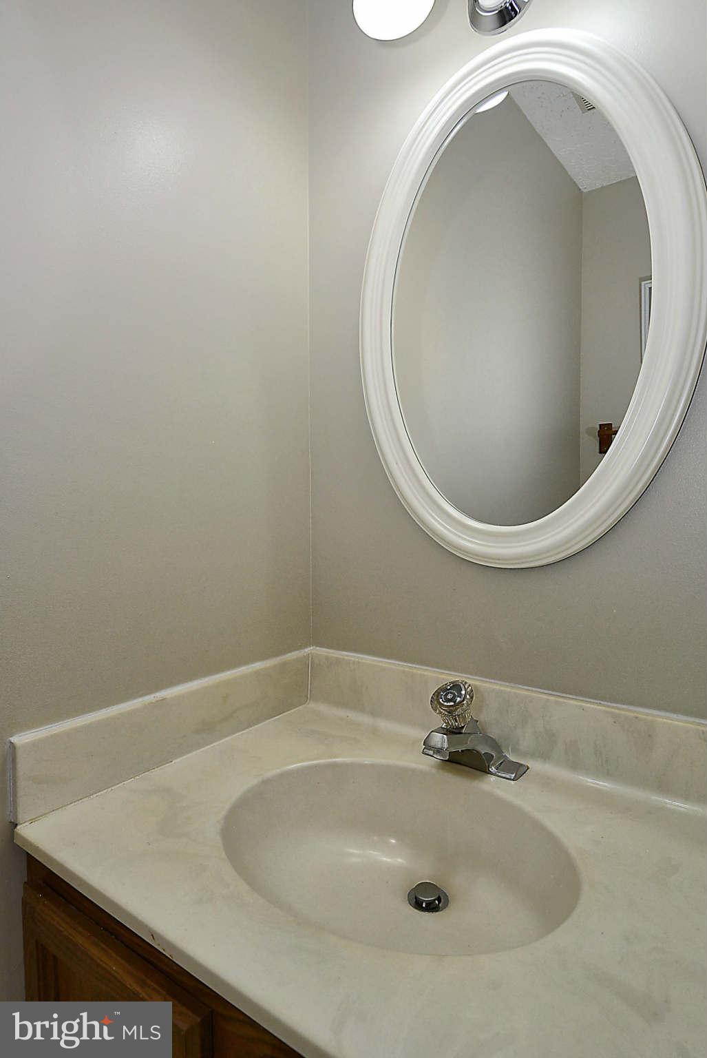 11457 Encore Drive Silver Spring, MD 20901 - Photo 7 of 27 a bathroom with a sink and mirror