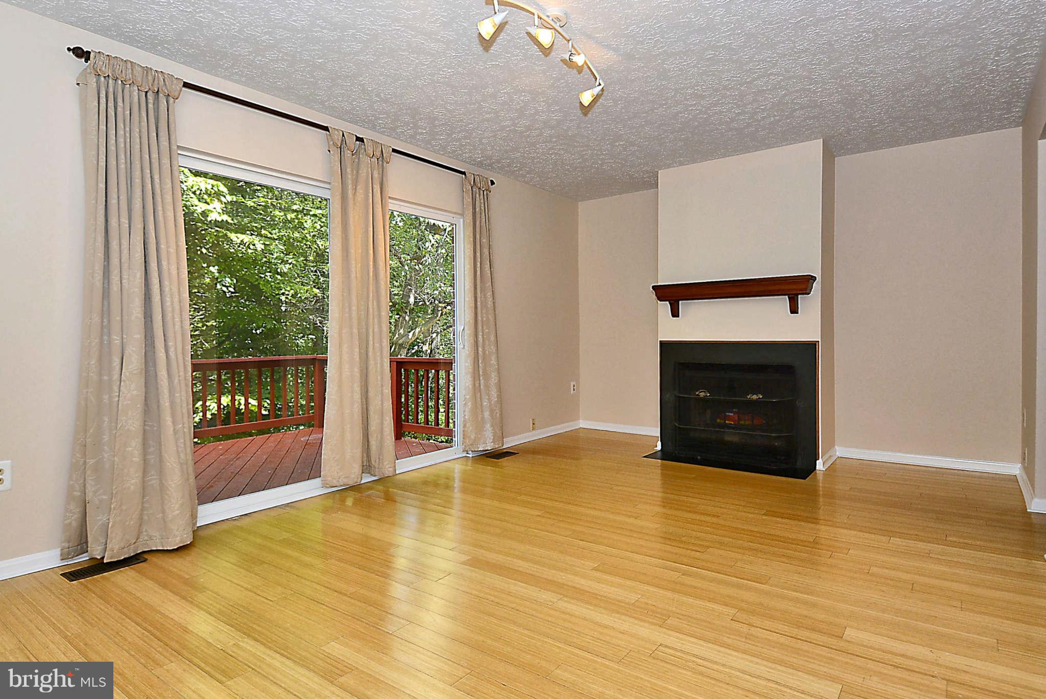 11457 Encore Drive Silver Spring, MD 20901 - Photo 8 of 27 a view of an empty room with glass door and a window