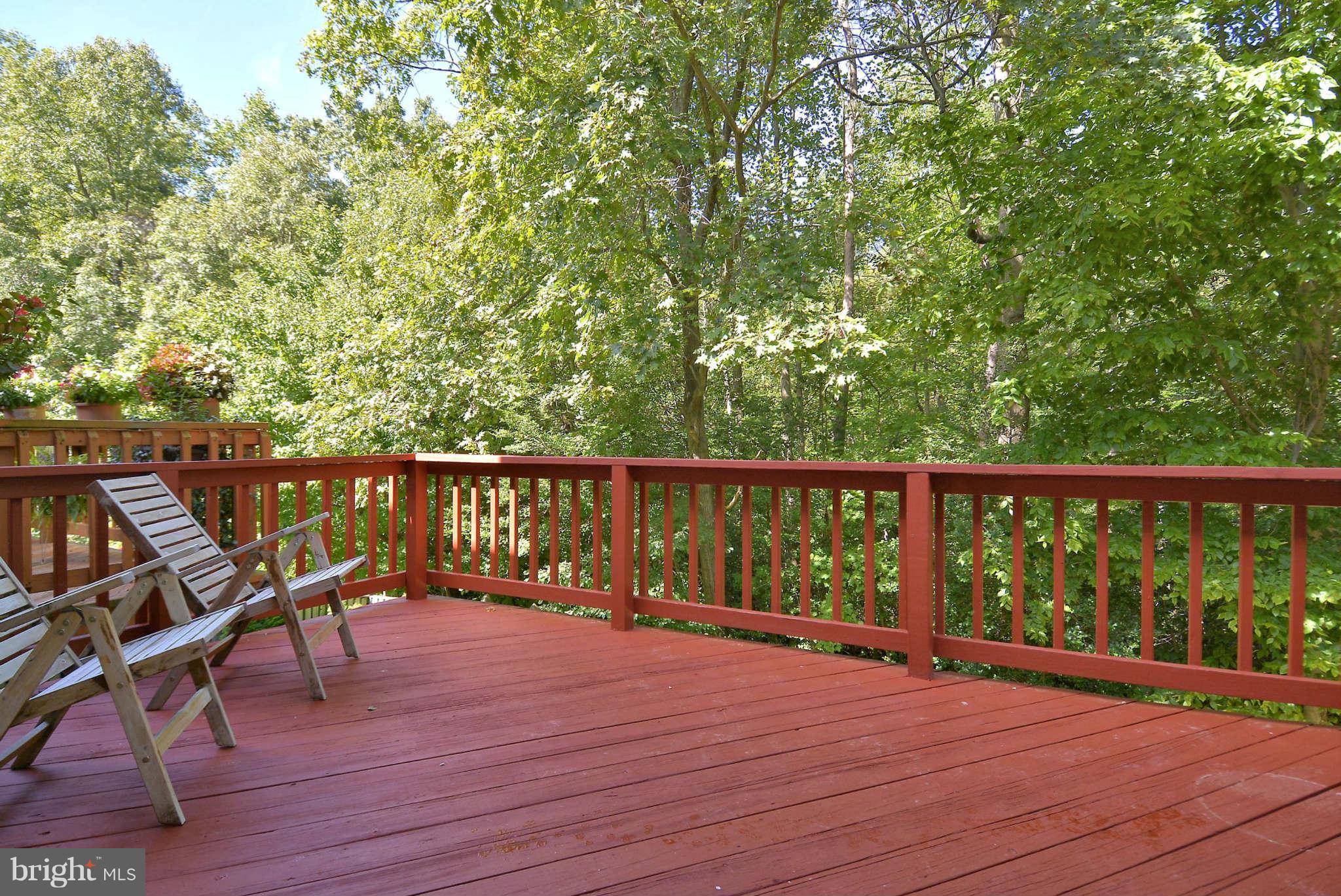 11457 Encore Drive Silver Spring, MD 20901 - Photo 10 of 27 a balcony with wooden floor and outdoor seating