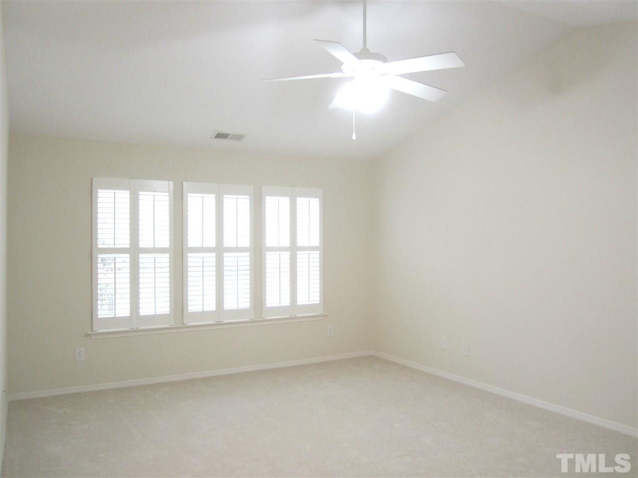 8217 Beaded Stone Street Raleigh, NC 27613 - Photo 11 of 16 an empty room with a window