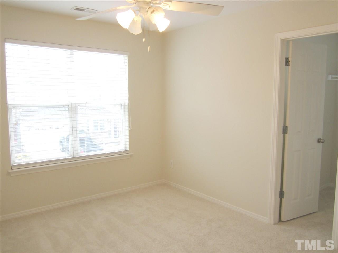 8217 Beaded Stone Street Raleigh, NC 27613 - Photo 13 of 16 an empty room with a window