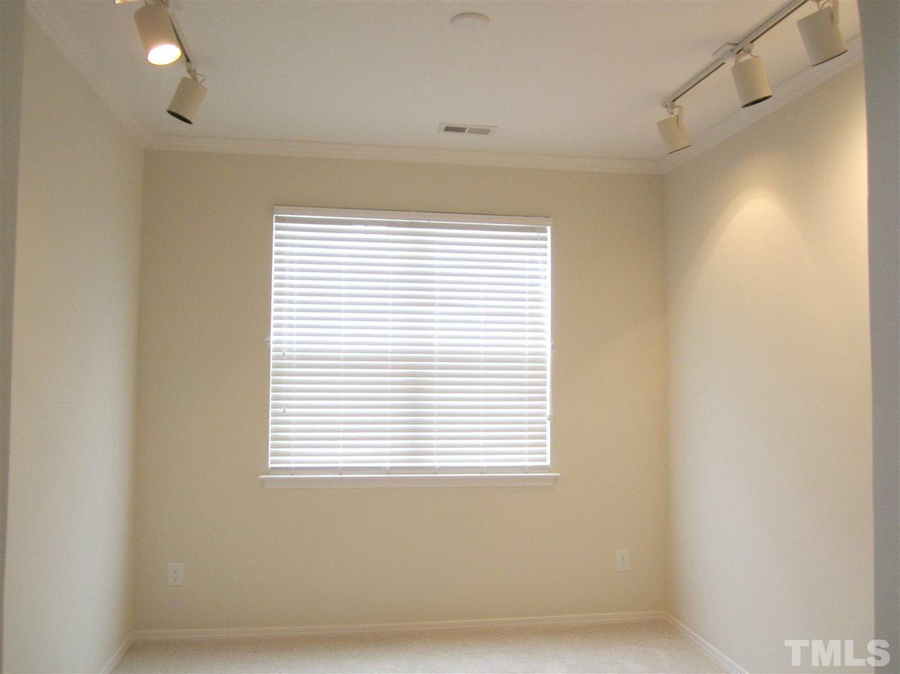 8217 Beaded Stone Street Raleigh, NC 27613 - Photo 4 of 16 a view of a small space with a window