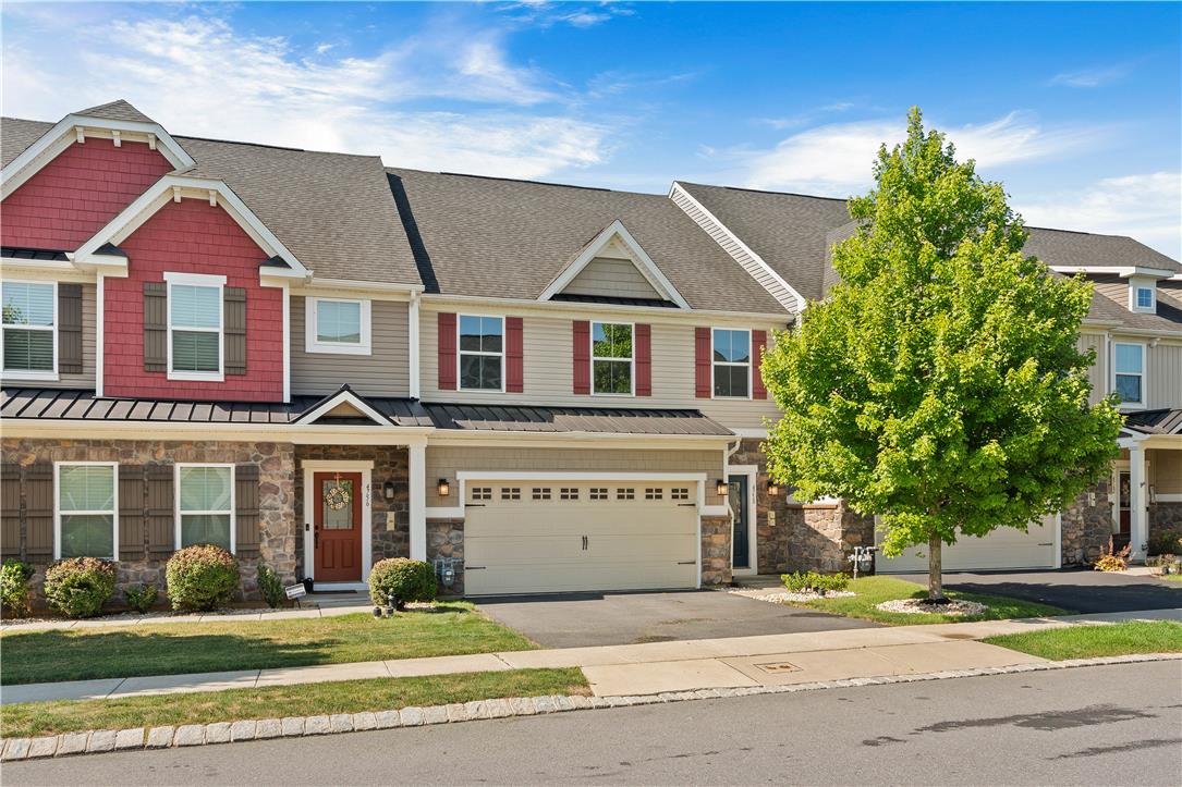 4758 Rafi Road Easton, PA 18045 - Photo 4 of 55 A welcoming facade showcases mixed-material construction and an attached garage, offering modern curb appeal.