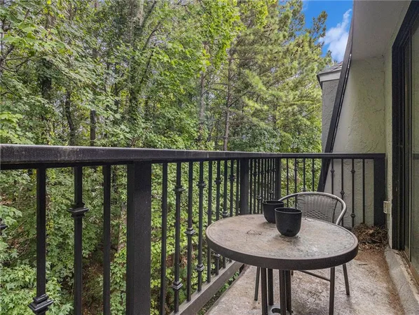 a view of balcony and table on the deck