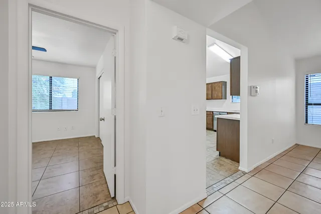 a view of a kitchen with wooden floor and a kitchen
