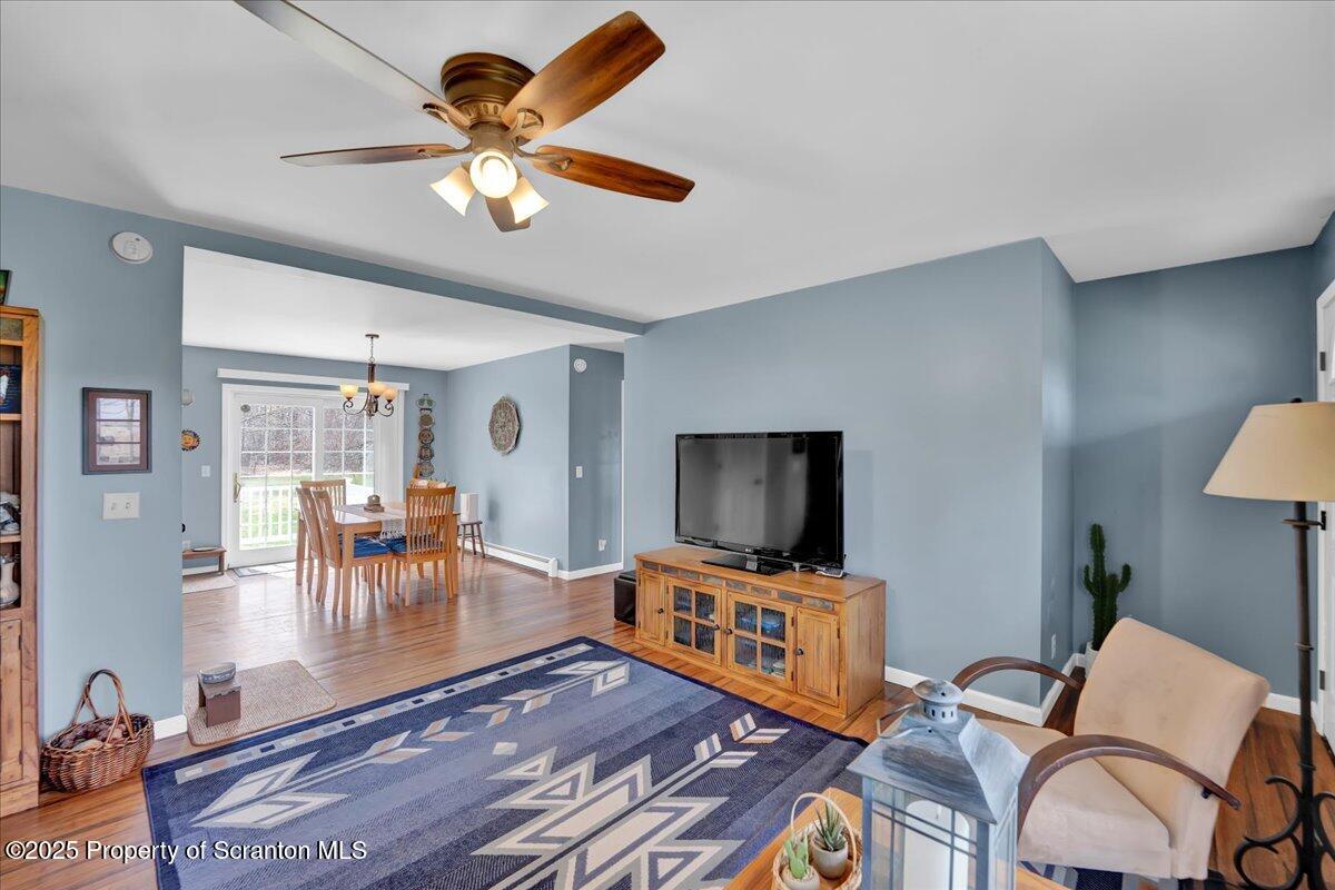 3330 Quicktown Road Moscow, PA 18444 - Photo 11 of 34 a living room with furniture and a flat screen tv