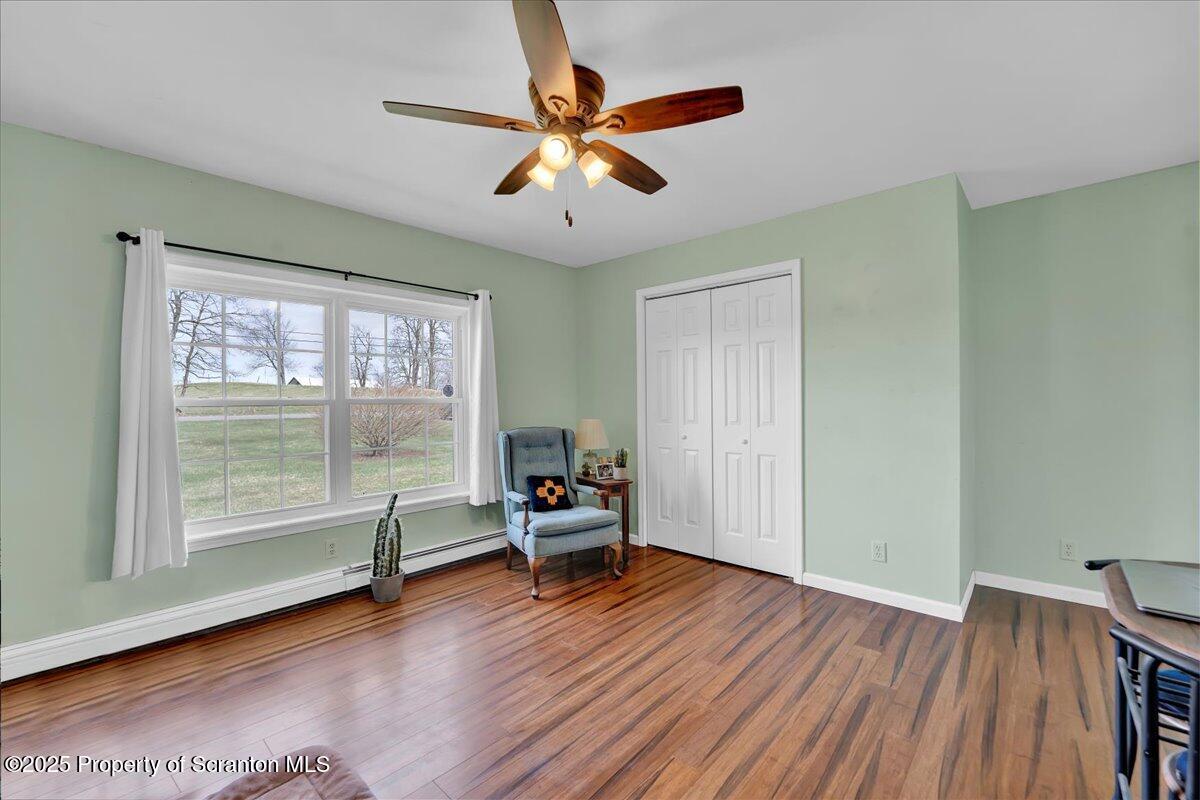 3330 Quicktown Road Moscow, PA 18444 - Photo 19 of 34 an empty room with wooden floor and windows