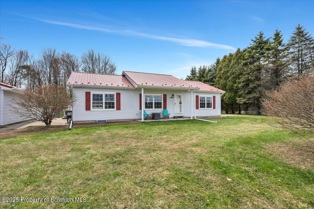 3330 Quicktown Road Moscow, PA 18444 - Photo 2 of 34 a front view of a house with a garden