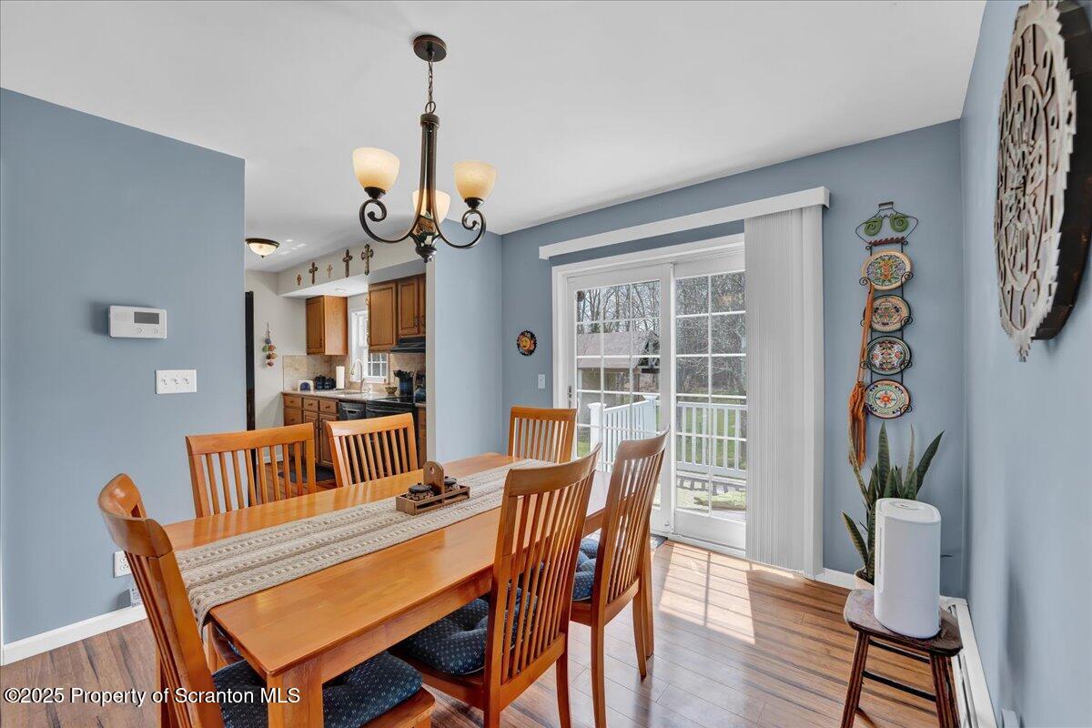 3330 Quicktown Road Moscow, PA 18444 - Photo 7 of 34 a view of a dining room with furniture window and wooden floor