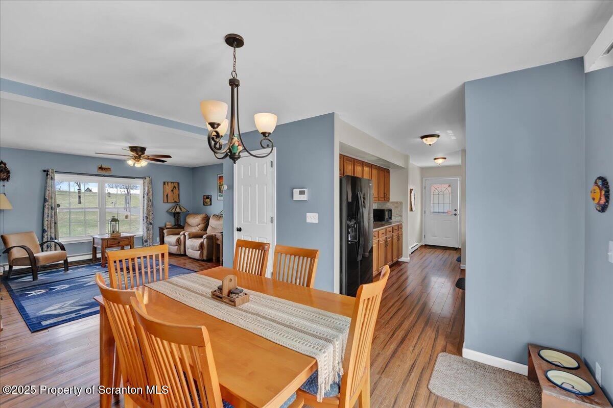 3330 Quicktown Road Moscow, PA 18444 - Photo 8 of 34 a view of a dining room with furniture and wooden floor