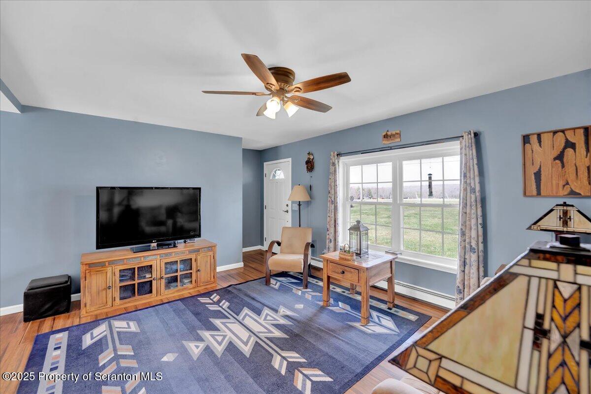 3330 Quicktown Road Moscow, PA 18444 - Photo 10 of 34 a living room with furniture and a flat screen tv
