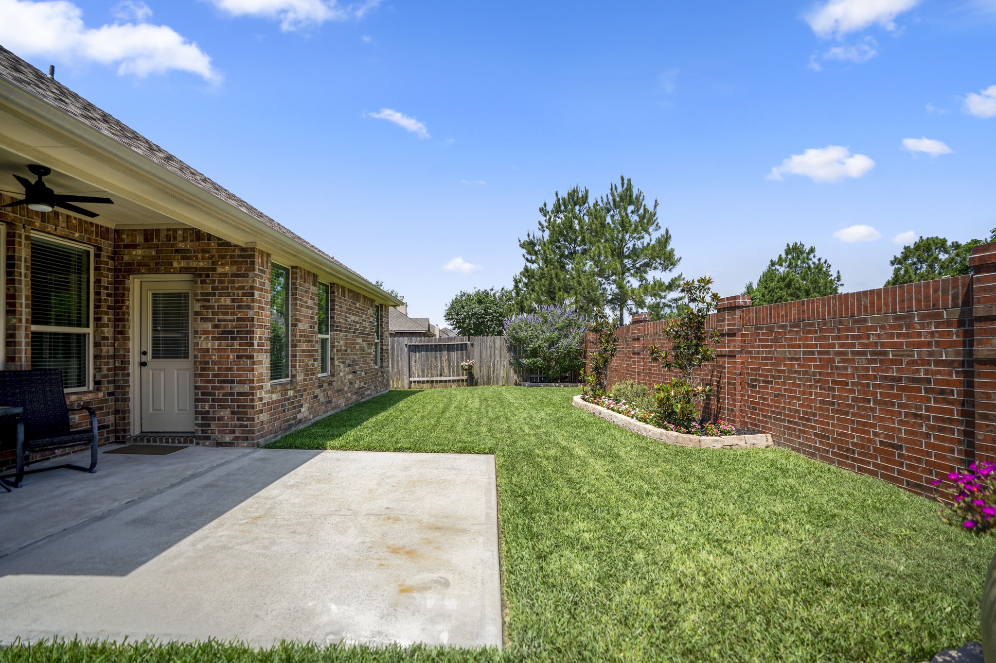 5522 Glenfield Spring Lane Spring, TX 77389 - Photo 33 of 46 Enjoy the expended patio and lush landscape.